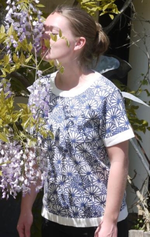 Feminine short Sleeved Pullover in White with flower Print from Piece of Blue  on model