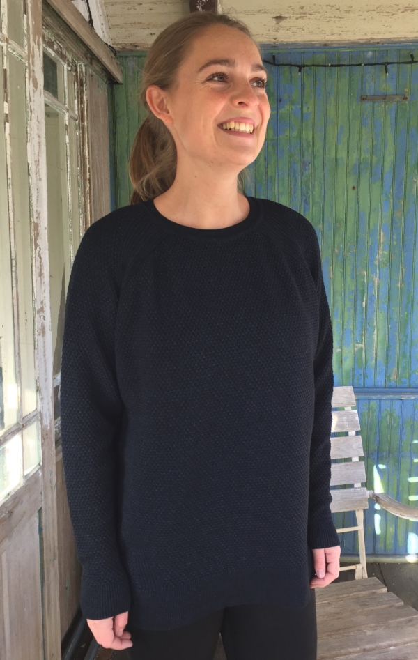Unique and Pretty Knit Pullover with Cables in Dark Indigo Blue for Her from Piece of Blue. Seen on model.